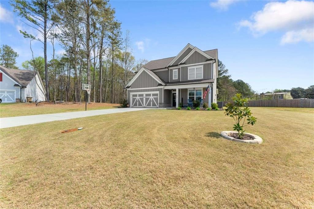 568 Dunagan Court Winder, GA 30680 - Photo 10 of 61 a front view of a house with a yard