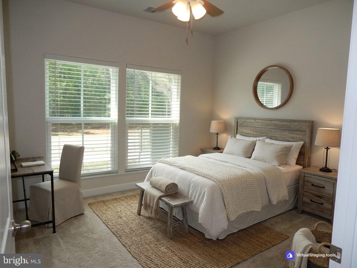36884 Red Cedar Loop Ocean View, DE 19970 - Photo 33 of 50 a bedroom with a bed and a chandelier