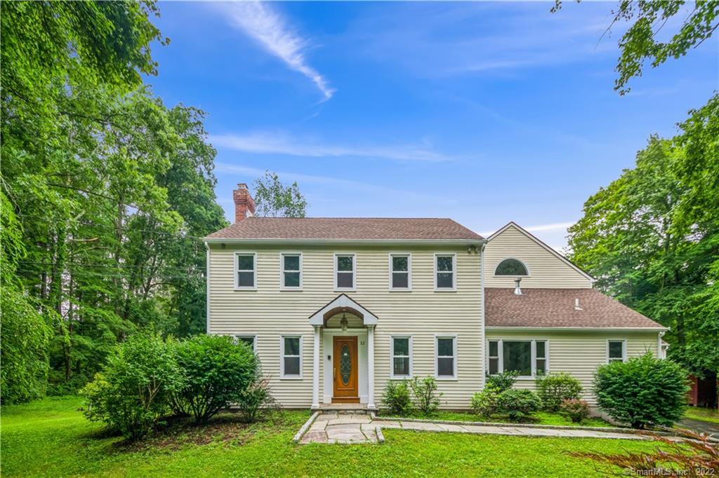 32 Echo Valley Road Newtown, CT 06470 - Photo 1 of 1 a front view of a house with a garden