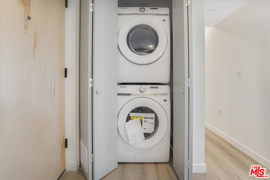 10918 Camarillo Street, Unit 103 North Hollywood, CA 91602 - Photo 14 of 38 a utility room with dryer and washer