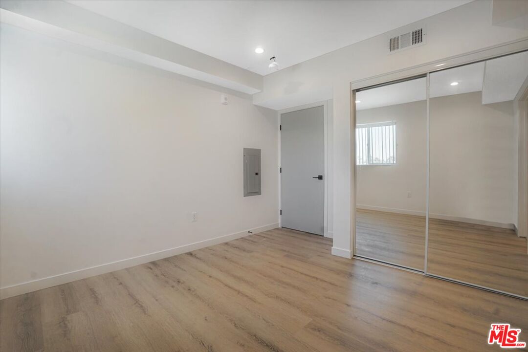 10918 Camarillo Street, Unit 103 North Hollywood, CA 91602 - Photo 18 of 38 wooden floor in an empty room