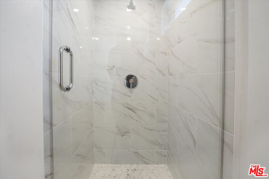 10918 Camarillo Street, Unit 103 North Hollywood, CA 91602 - Photo 21 of 38 a bathroom with a shower
