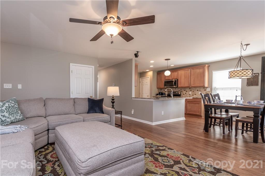 1435 Haverford Road Northwest Concord, NC 28027 - Photo 22 of 31 a living room with furniture and kitchen view