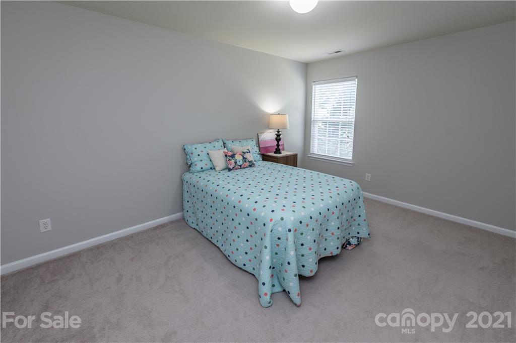 1435 Haverford Road Northwest Concord, NC 28027 - Photo 26 of 31 a bedroom with a bed and window