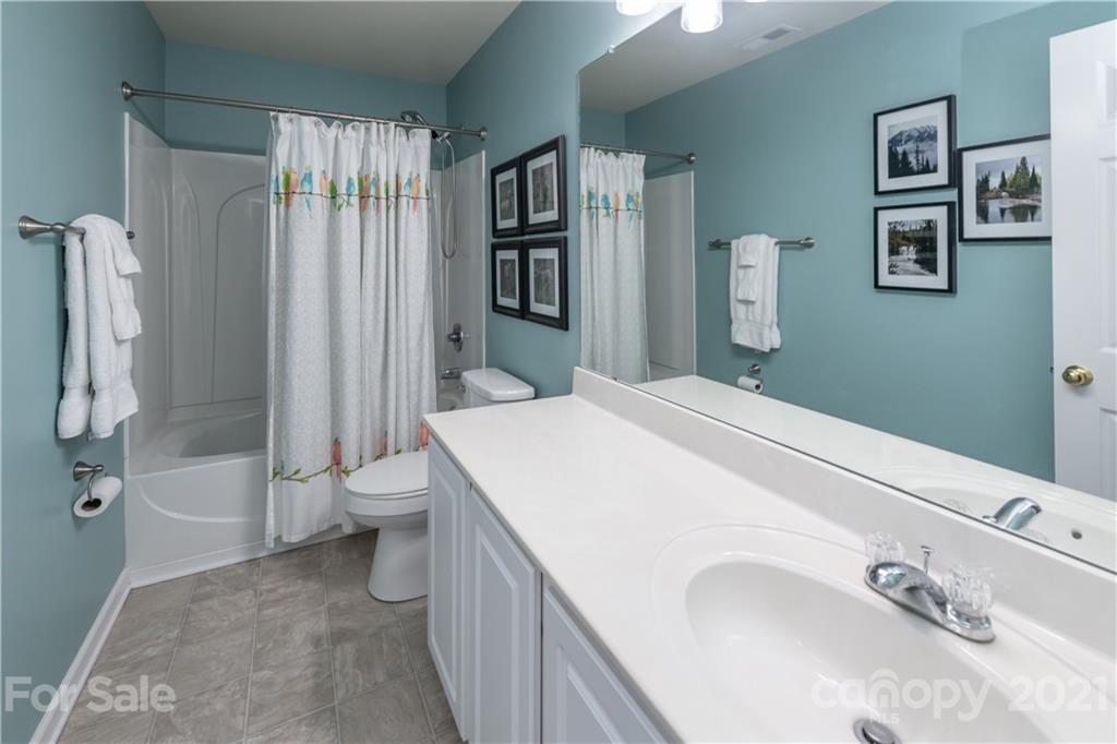 1435 Haverford Road Northwest Concord, NC 28027 - Photo 28 of 31 a bathroom with a sink a toilet and shower