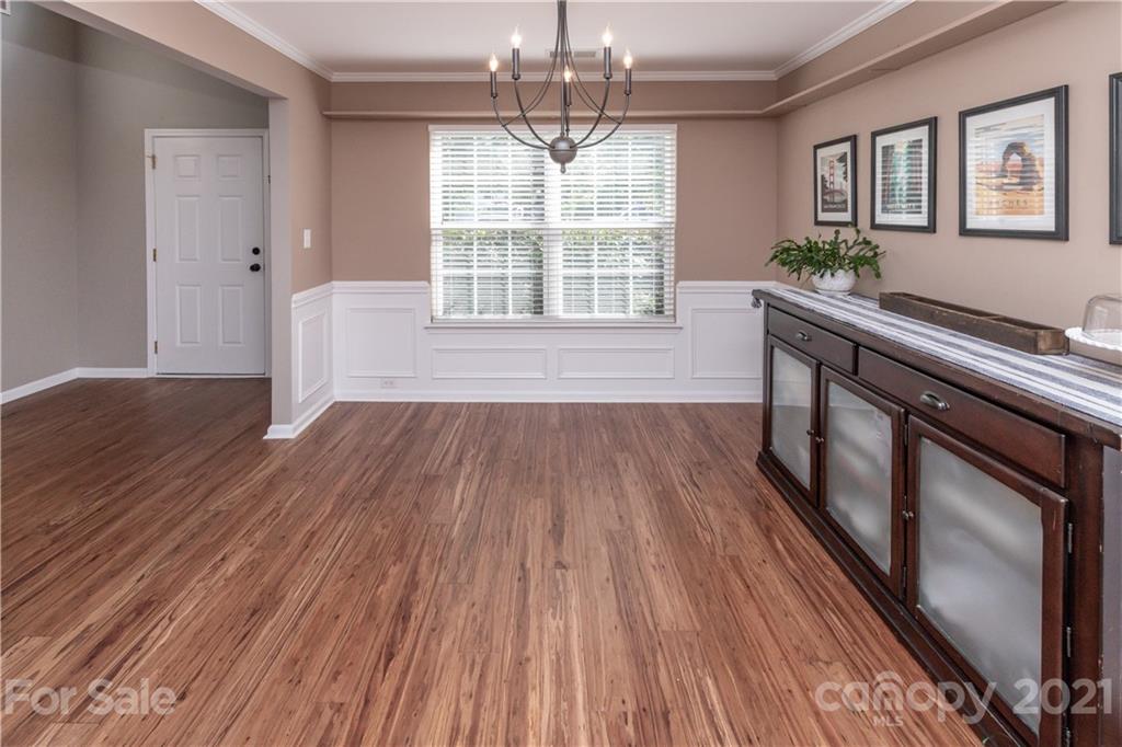 1435 Haverford Road Northwest Concord, NC 28027 - Photo 8 of 31 a view of empty room with wooden floor and fan