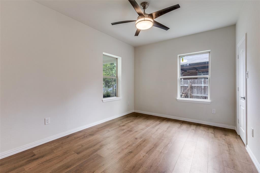 4536 Birch Street Dallas, TX 75223 - Photo 11 of 25 a view of an empty room with wooden floor and a window