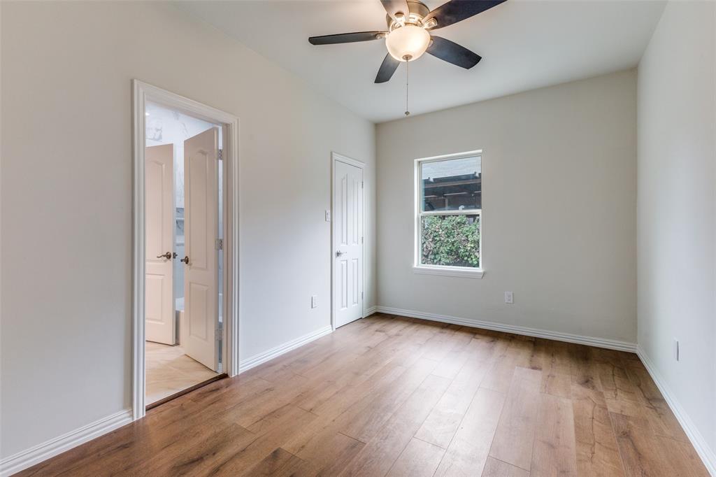 4536 Birch Street Dallas, TX 75223 - Photo 13 of 25 a view of an empty room with wooden floor and a window