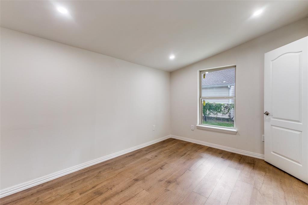 4536 Birch Street Dallas, TX 75223 - Photo 17 of 25 an empty room with wooden floor and window