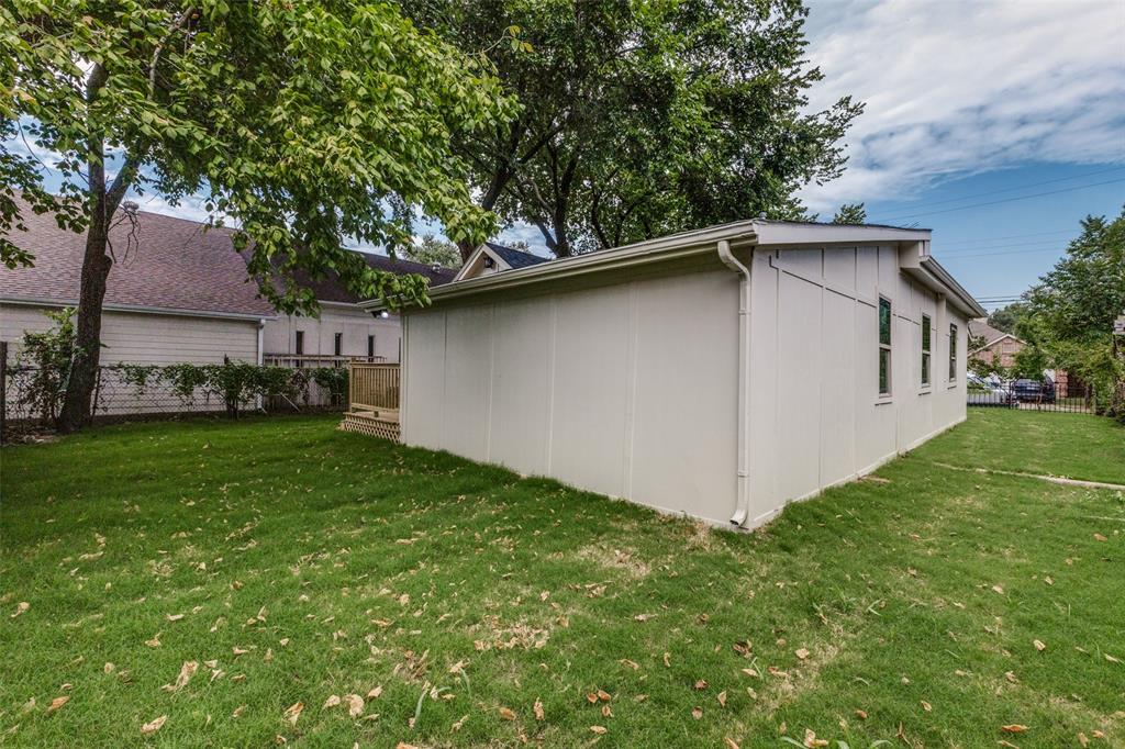 4536 Birch Street Dallas, TX 75223 - Photo 24 of 25 a white house that has tree in front of it