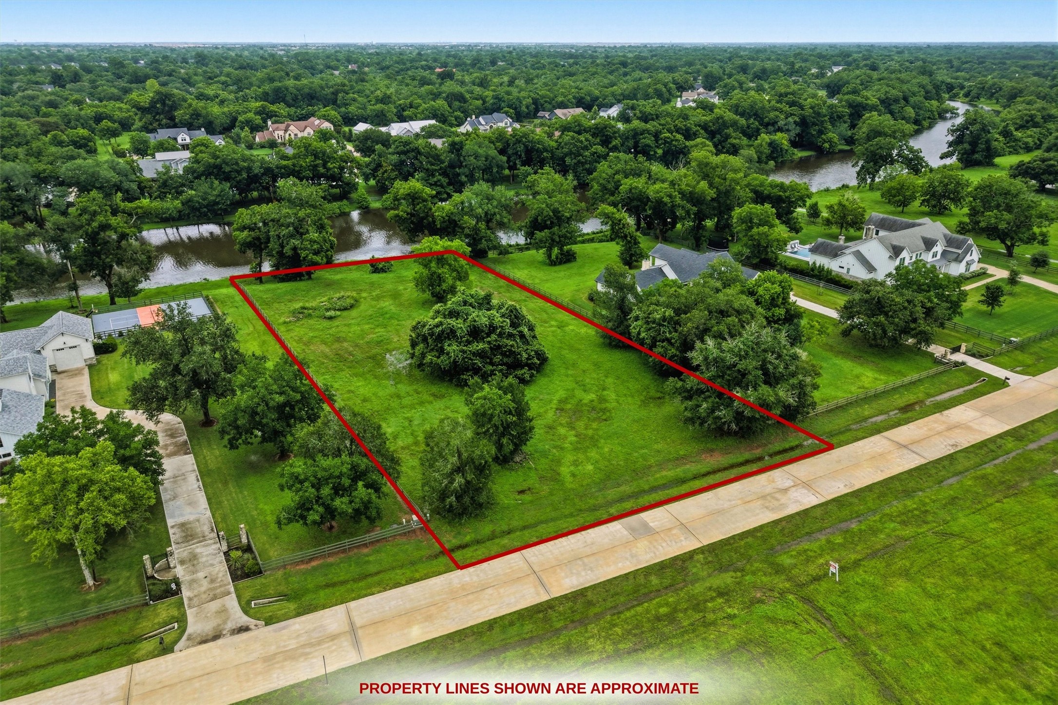 0 Riverlake Road Fulshear, TX 77441 - Photo 20 of 47 Approximate property lines illustrate the substantial street frontage and expansive building area available. Bring your vision to life and create a truly exceptional custom estate in one of Fulshear's most prestigious communities. Buyer to verify dimensions.