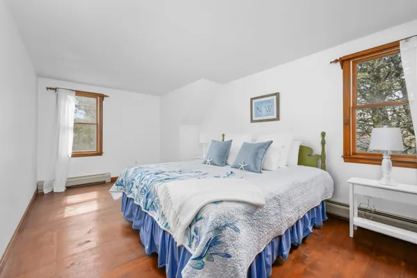 a backyard of a house with large trees