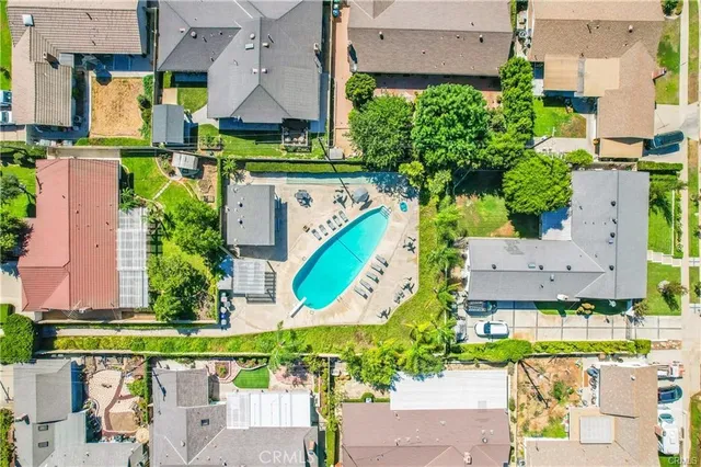 an aerial view of a house with a swimming pool