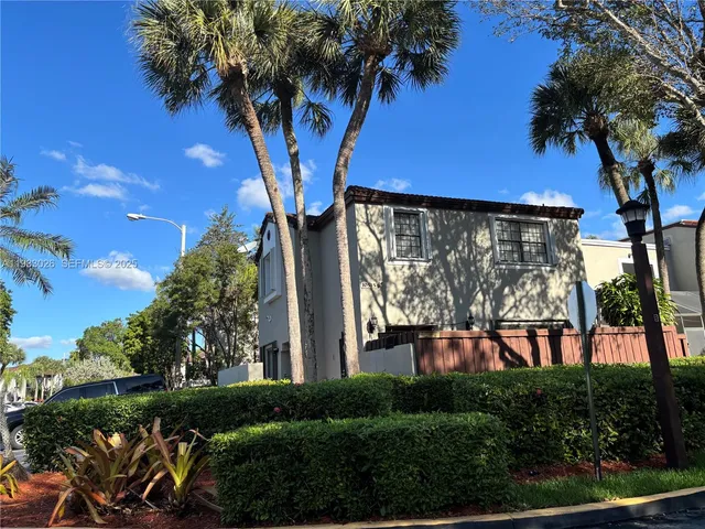 a view of a swimming pool with a yard