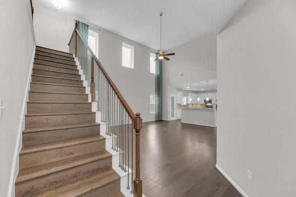 a view of entryway and hall with wooden floor