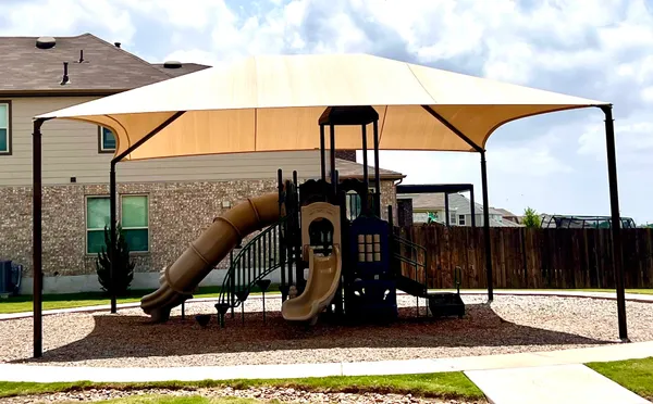 a view of gym equipment with a patio
