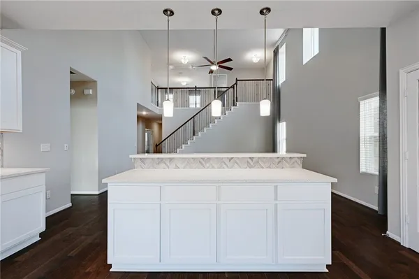 a kitchen with a sink a refrigerator and a stove