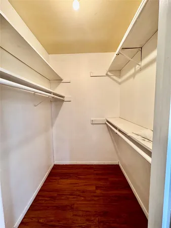 a view of an empty walk in closet