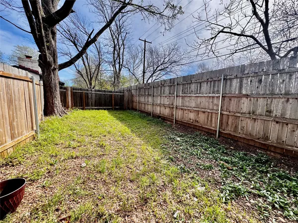 a view of a backyard of the house