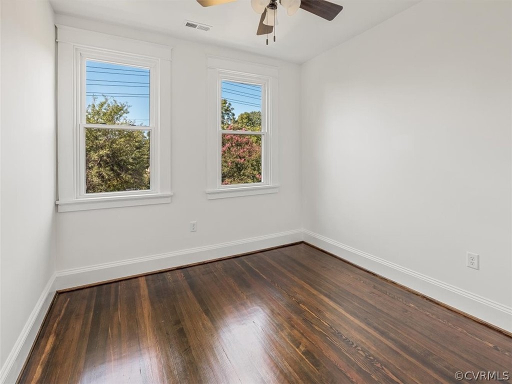 4209 Brook Road Richmond, VA 23227 - Photo 44 of 46 an empty room with wooden floor and windows