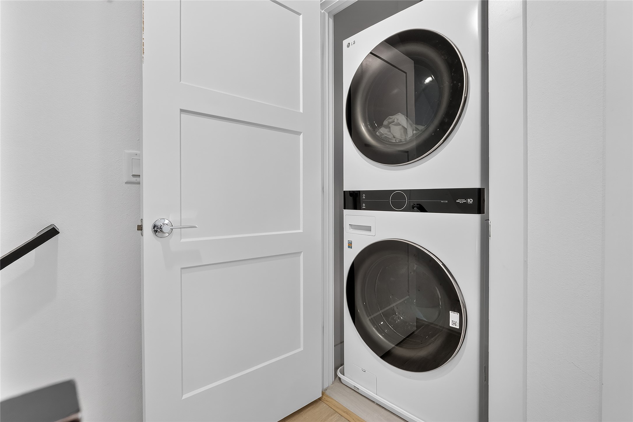 2805 McCurdy Street, Unit 14 Austin, TX 78723 - Photo 17 of 40 A well-appointed laundry area offers practical convenience with stacked appliances.