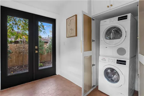 a view of a hallway with washer and dryer