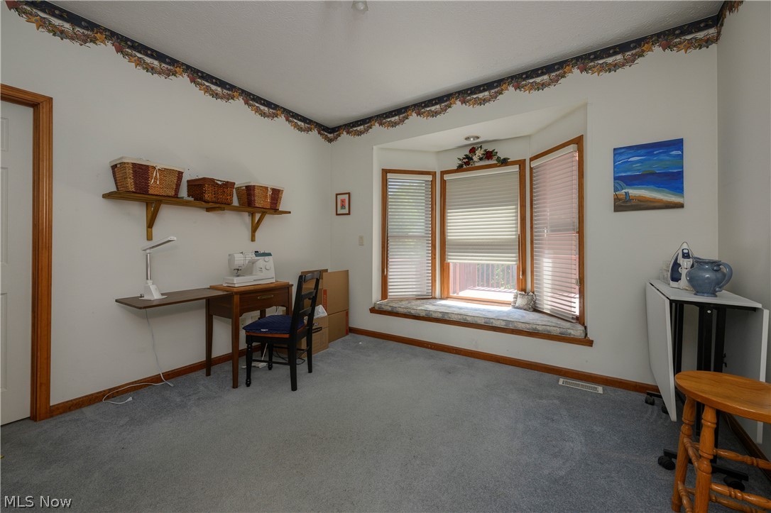 8745 Broadview Road Broadview Heights, OH 44147 - Photo 13 of 49 Bay window with built-in seating, carpeted flooring, and wall-mounted shelving