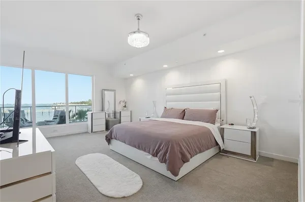 a bathroom with a shower a sink a mirror and a bathtub