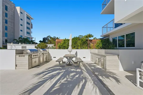 a view of building with garden and trees