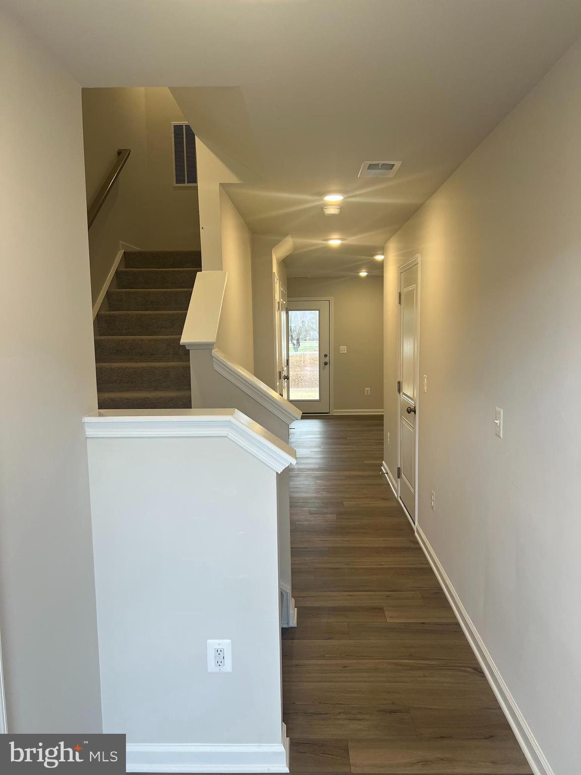 238 Cooperage Road Inwood, WV 25428 - Photo 3 of 27 a view of a hallway with wooden floor