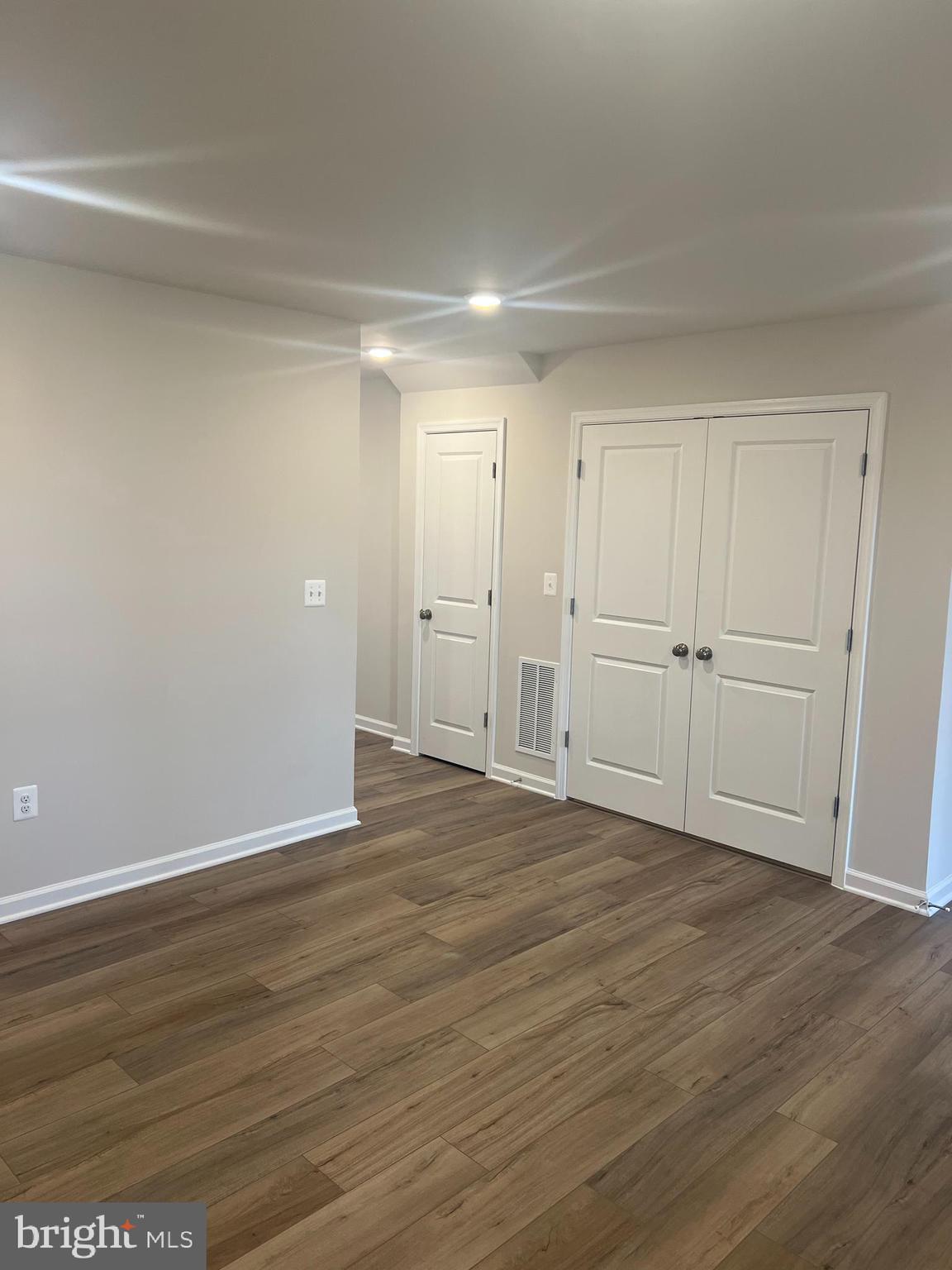 238 Cooperage Road Inwood, WV 25428 - Photo 5 of 27 a view of an empty room with wooden floor