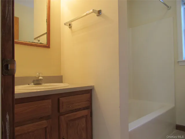 a white toilet sitting next to a window