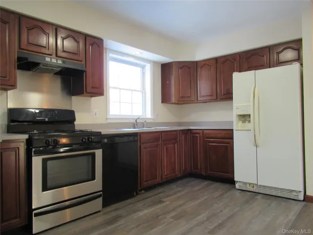 a bathroom with a bathtub and a sink