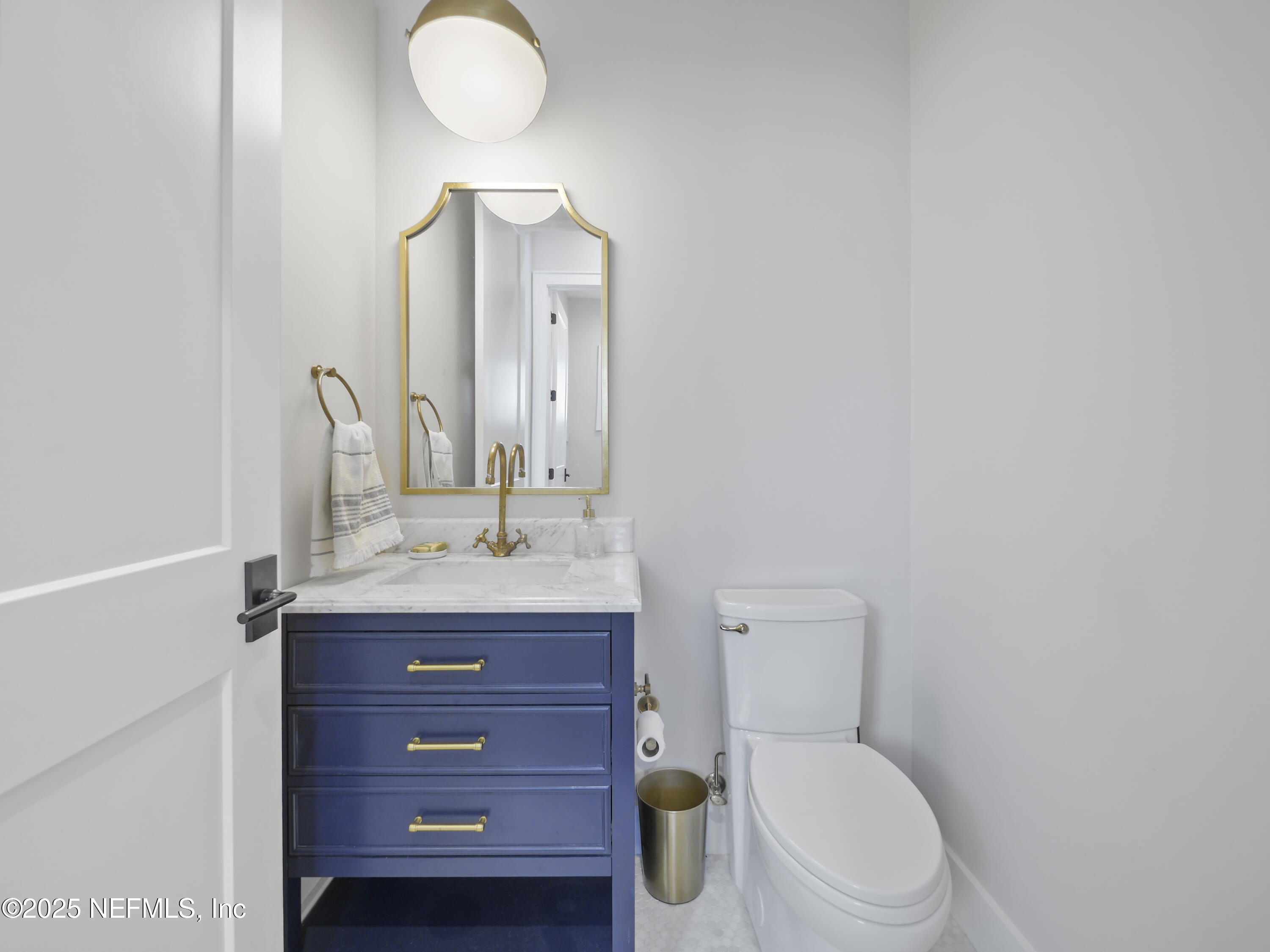 4021 Myrtle Street St. Augustine, FL 32084 - Photo 12 of 68 a bathroom with a toilet sink and mirror