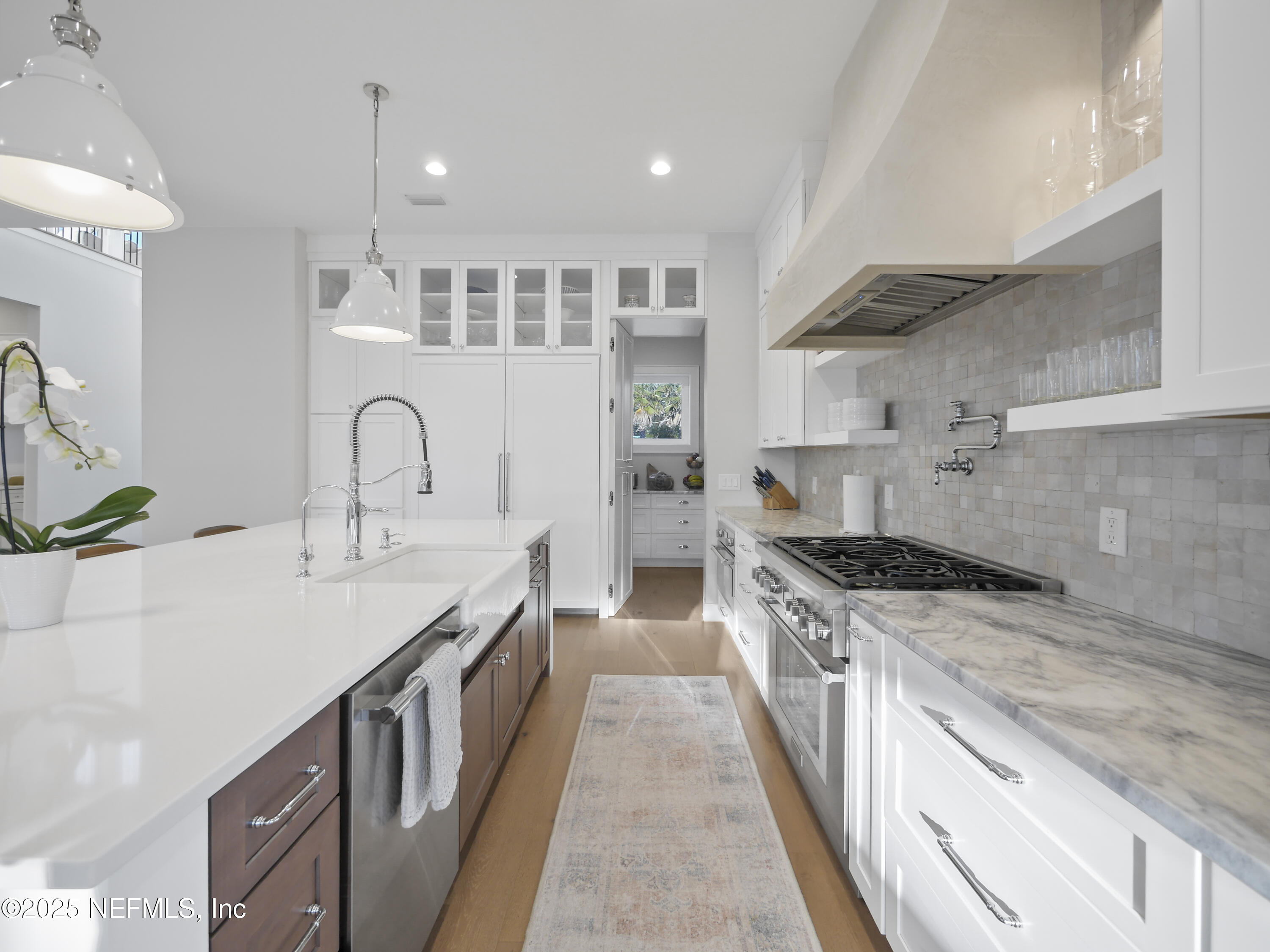 4021 Myrtle Street St. Augustine, FL 32084 - Photo 16 of 68 a kitchen with granite countertop a sink and stove top oven