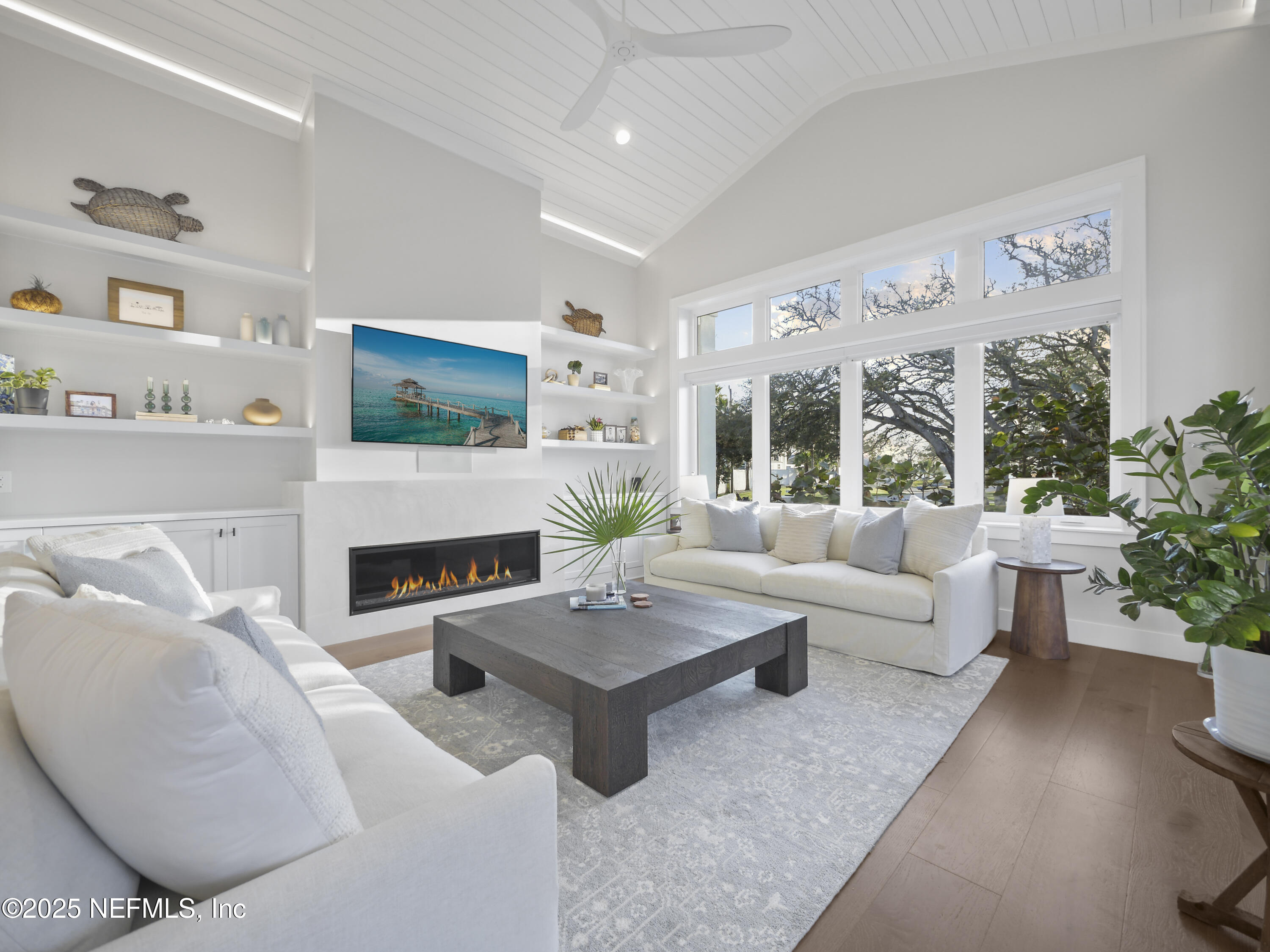 4021 Myrtle Street St. Augustine, FL 32084 - Photo 22 of 68 a living room with furniture fireplace and potted plants