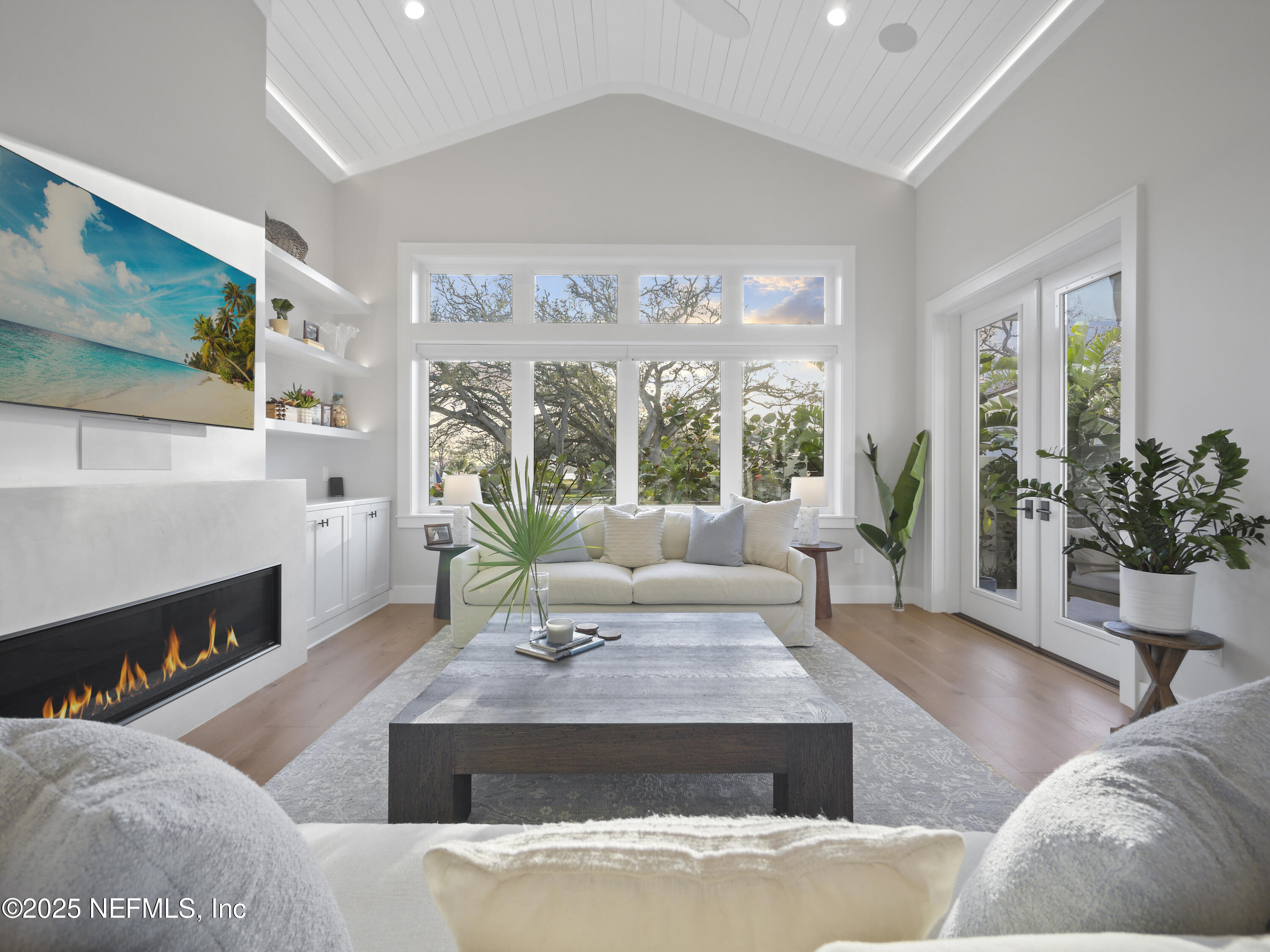 4021 Myrtle Street St. Augustine, FL 32084 - Photo 3 of 68 a living room with furniture large window and flat screen tv