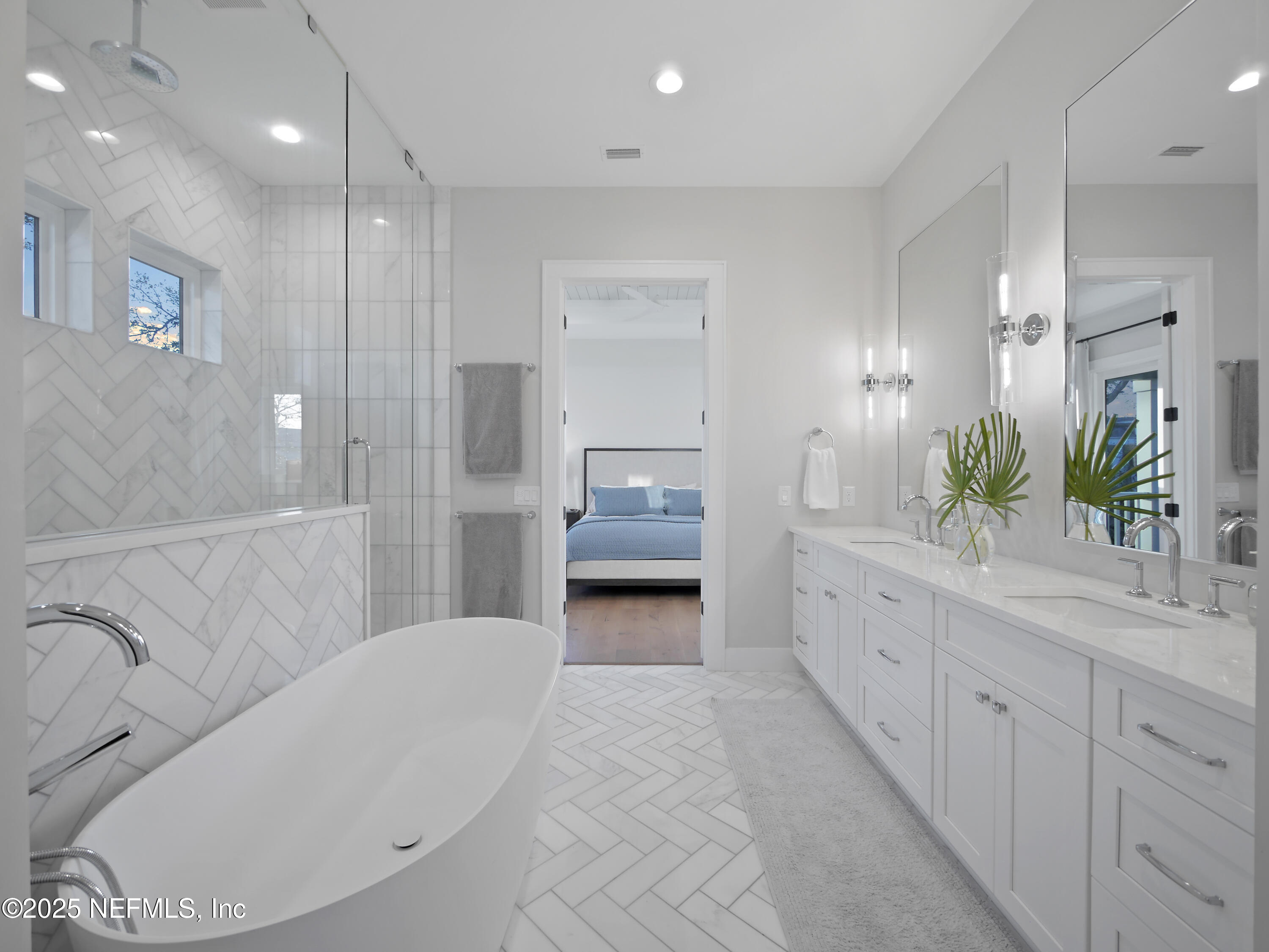 4021 Myrtle Street St. Augustine, FL 32084 - Photo 31 of 68 a bathroom with a double vanity sink and mirror