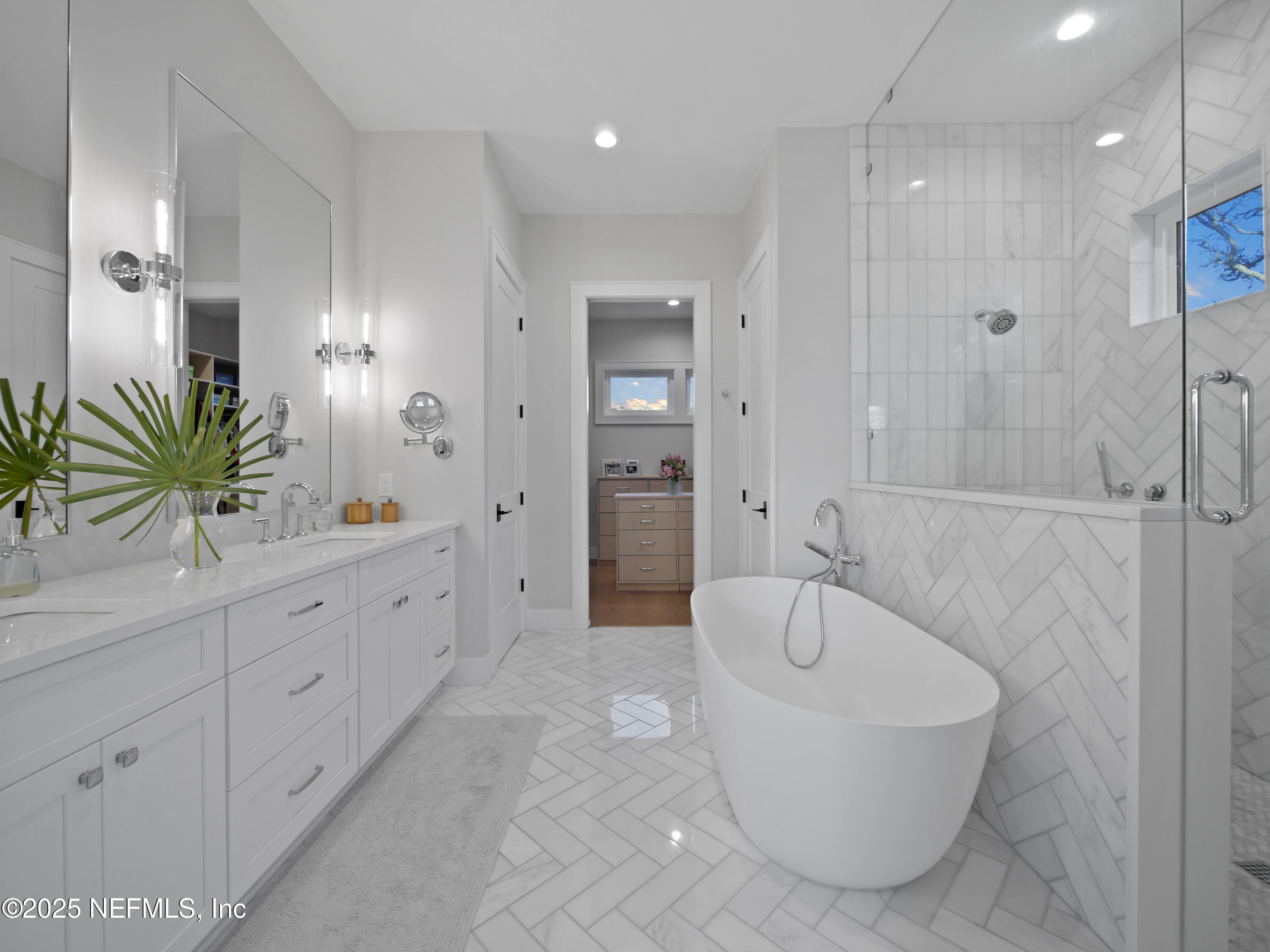 4021 Myrtle Street St. Augustine, FL 32084 - Photo 32 of 68 a spacious bathroom with a tub sink and mirror