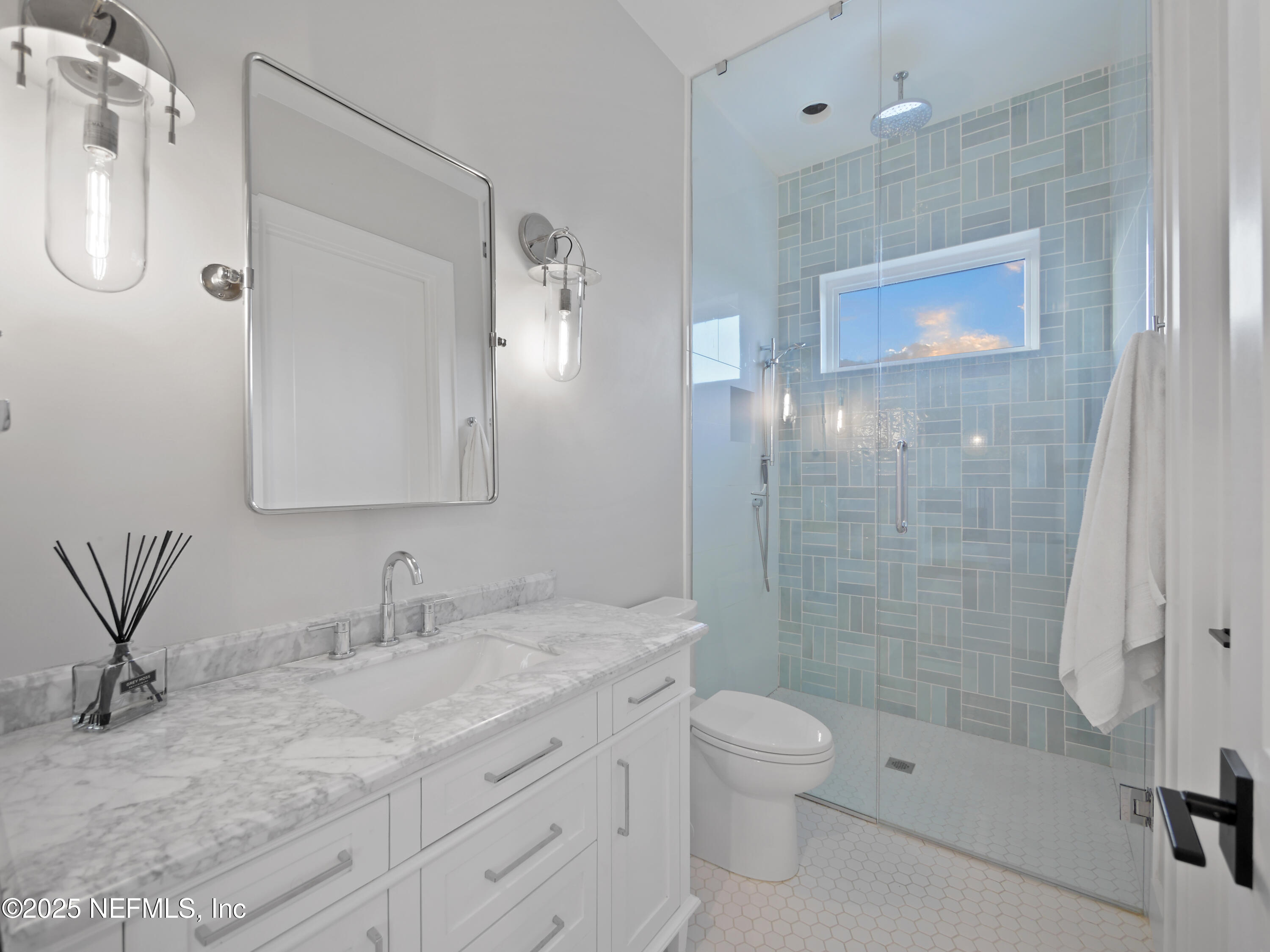 4021 Myrtle Street St. Augustine, FL 32084 - Photo 37 of 68 a bathroom with a granite countertop sink a toilet and shower