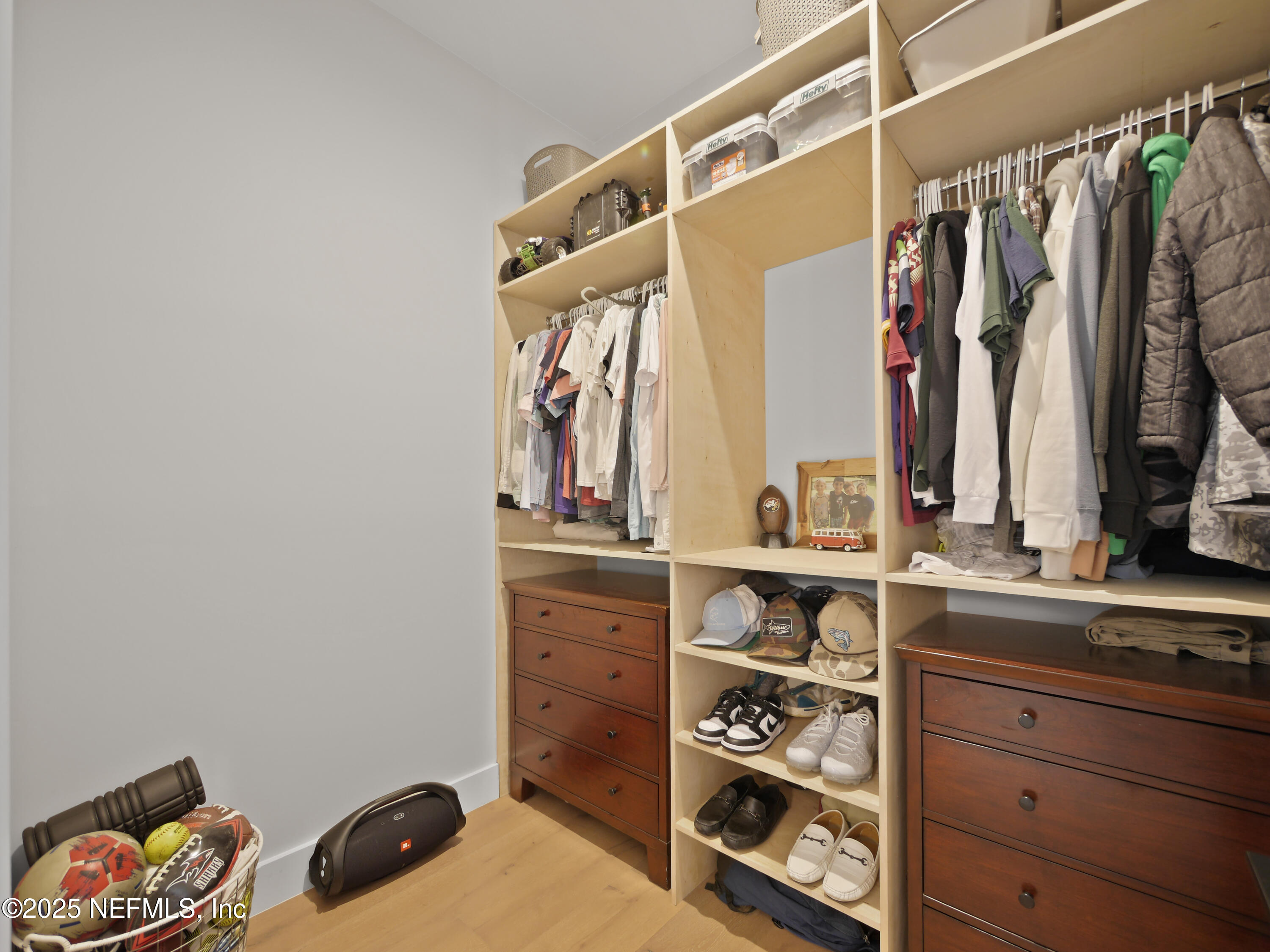 4021 Myrtle Street St. Augustine, FL 32084 - Photo 38 of 68 a view of walk in closet with clothes and shoes