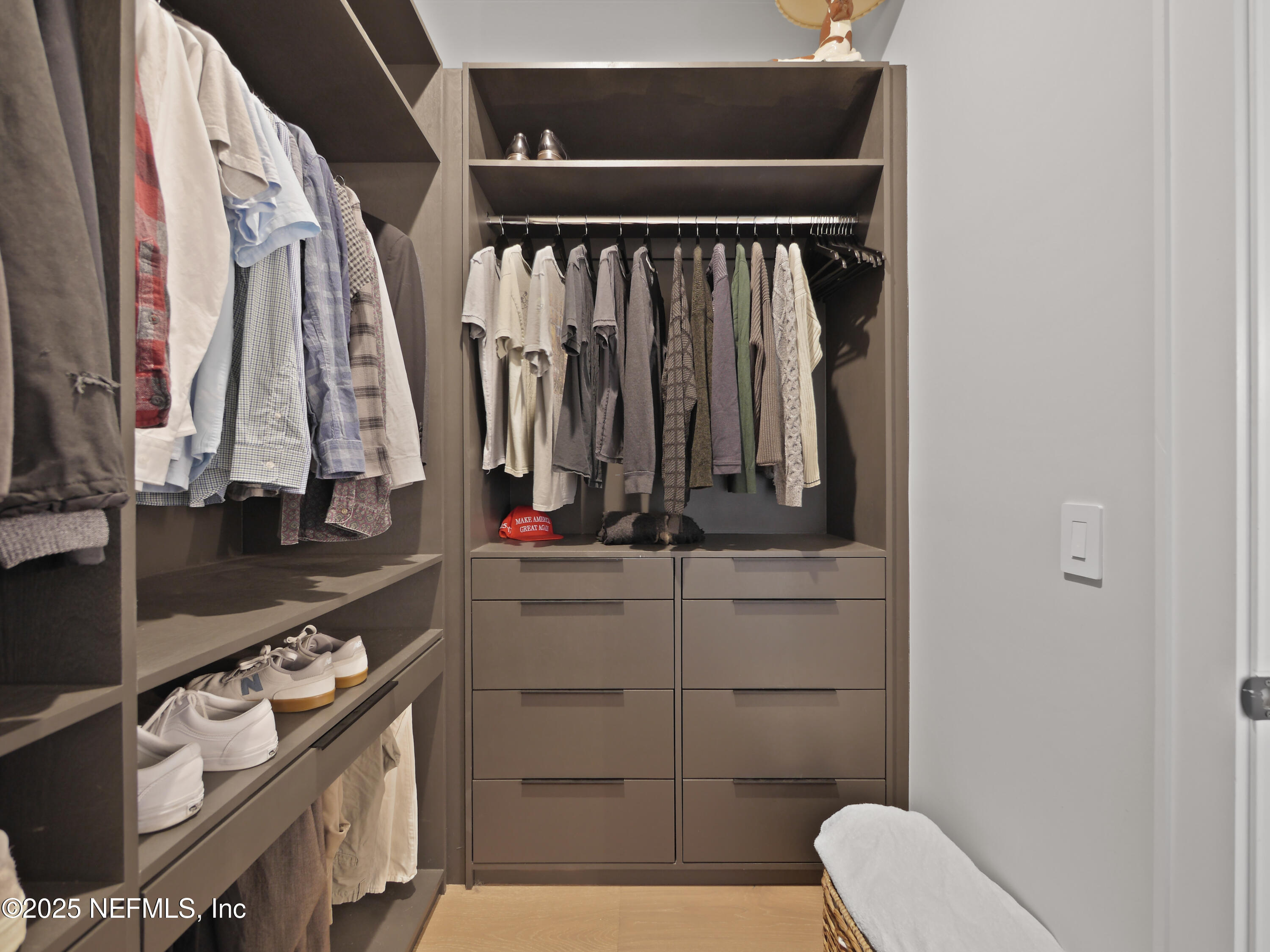 4021 Myrtle Street St. Augustine, FL 32084 - Photo 42 of 68 a view of walk in closet with clothes and shoes