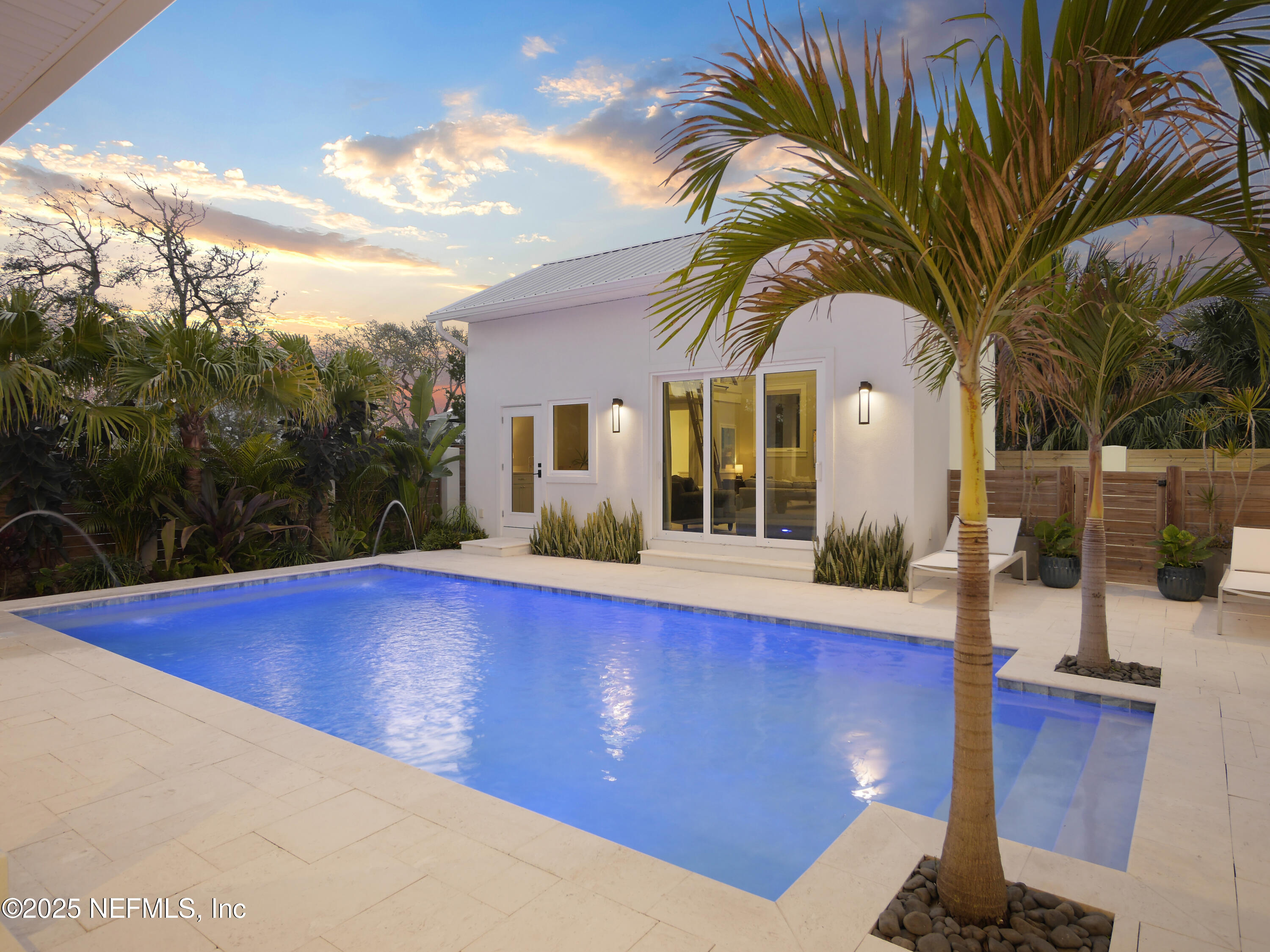 4021 Myrtle Street St. Augustine, FL 32084 - Photo 54 of 68 a view of swimming pool with outdoor seating and house in the background