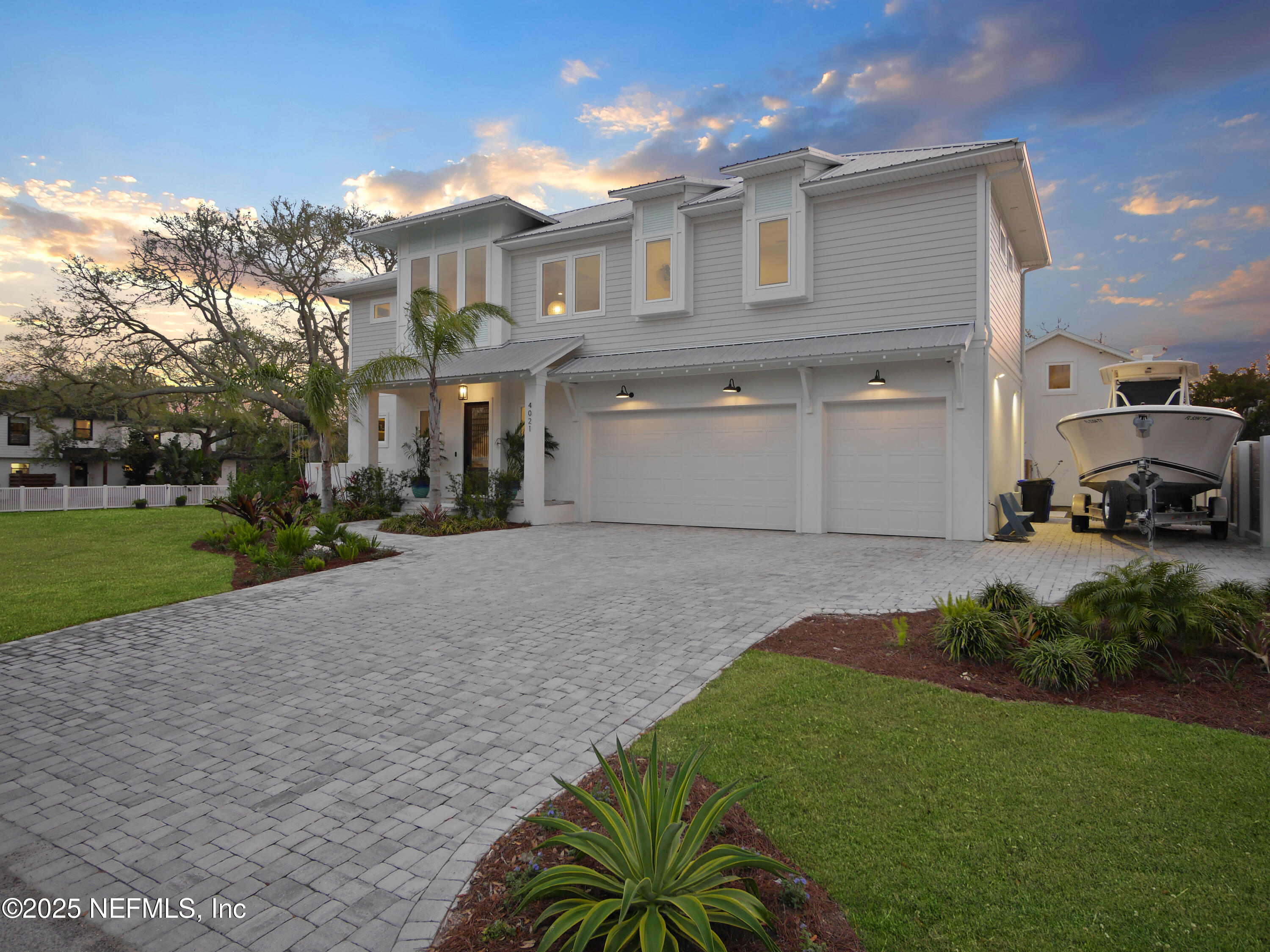 4021 Myrtle Street St. Augustine, FL 32084 - Photo 62 of 68 a view of a white house with a yard and plants