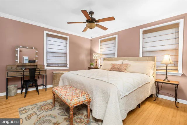 a bedroom with a bed and a table