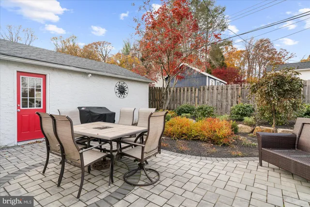 a view of a chairs and table in a patio