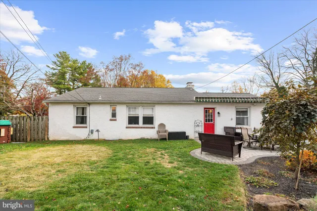 a house view with a sitting space and garden