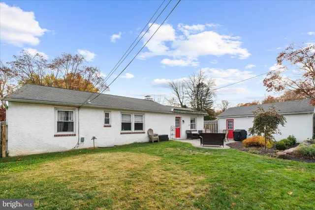 a front view of house with yard and seating area