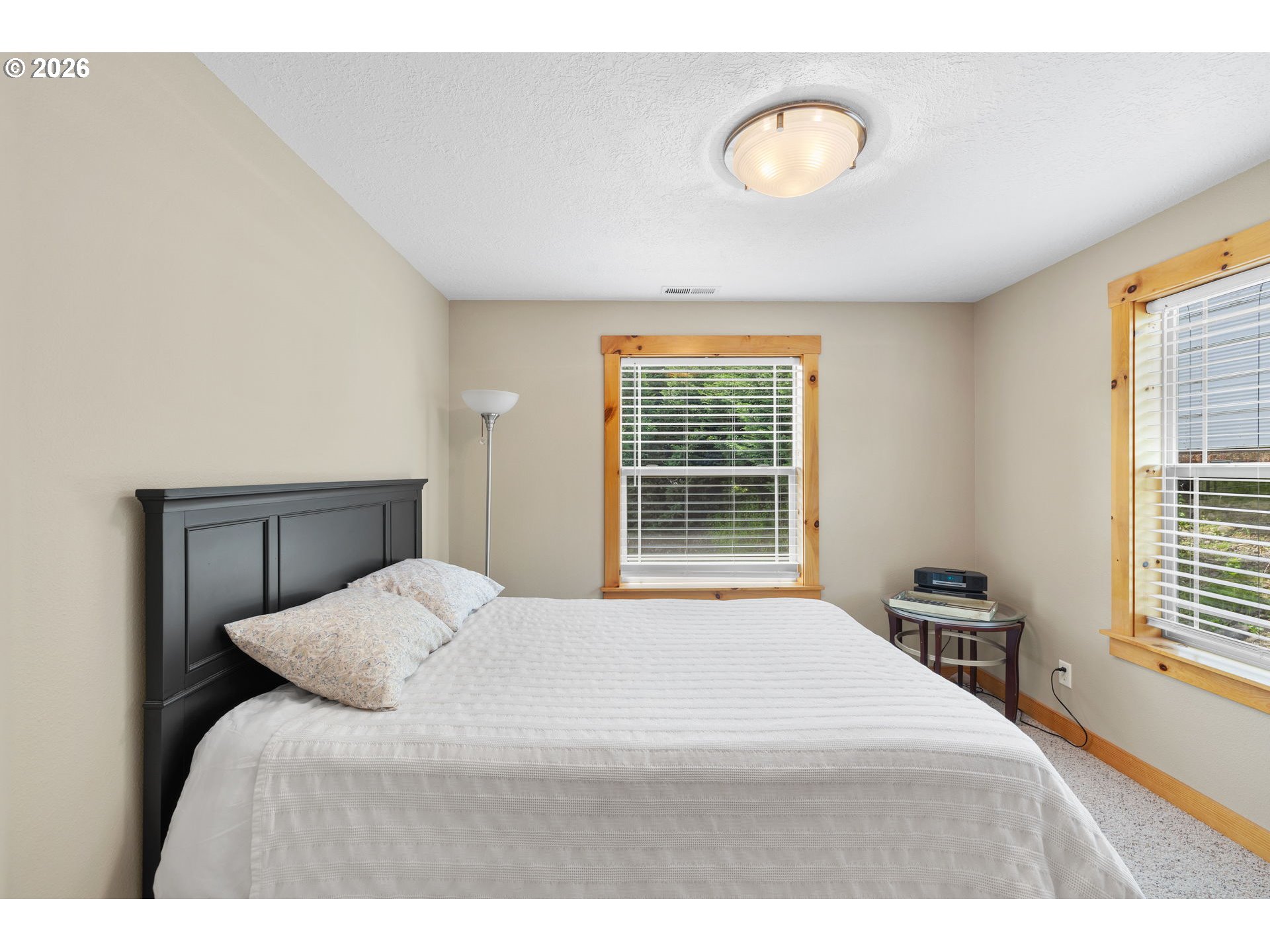 210 Southeast Whitten Road Mill City, OR 97360 - Photo 29 of 48 a bedroom with a bed and a window