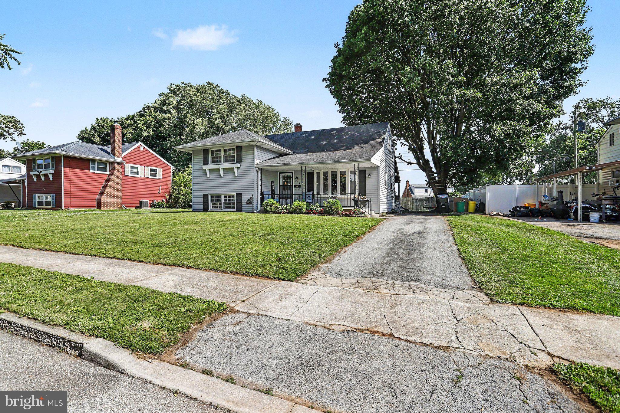 756 Fireside Road York, PA 17404 - Photo 4 of 29 Charming home with lush green lawn.